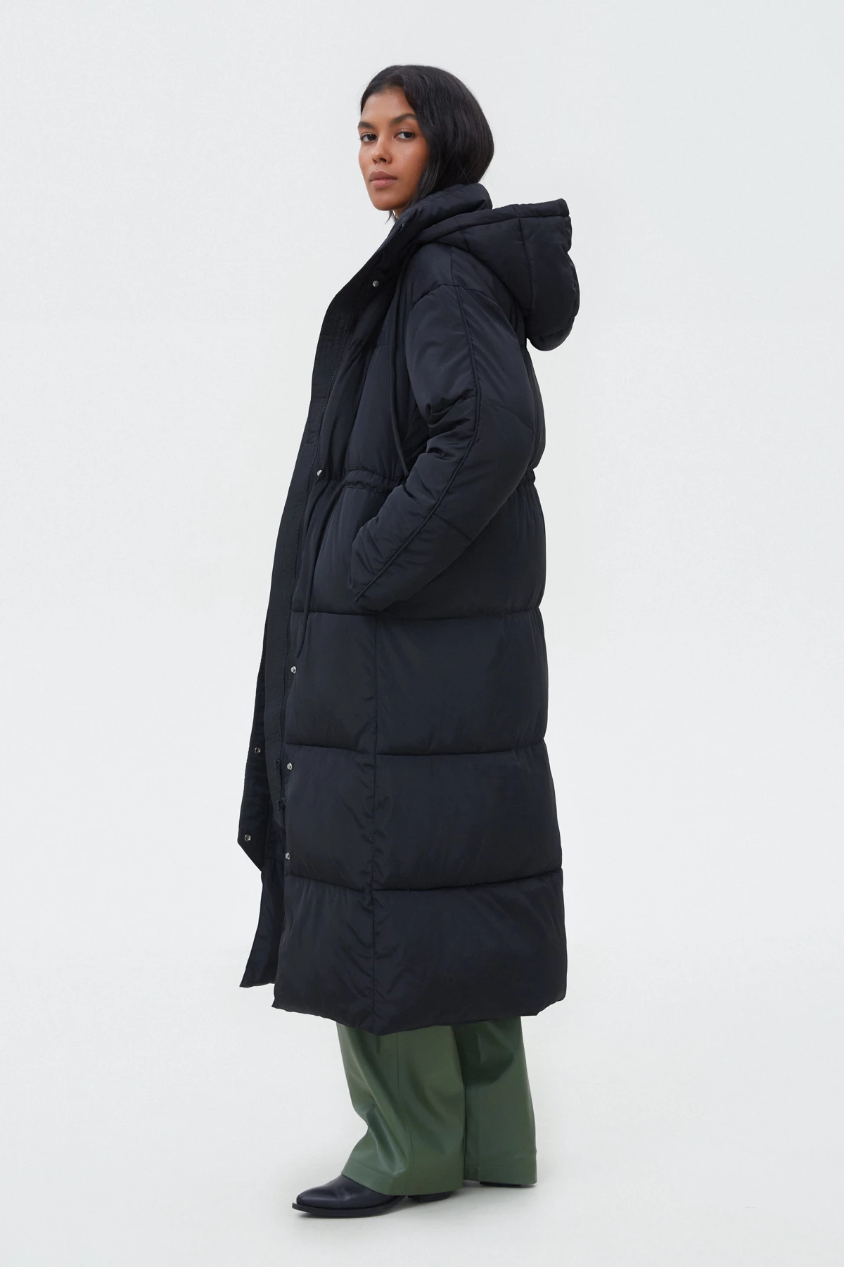 Black long quilted coat with waist line accent, photo 1